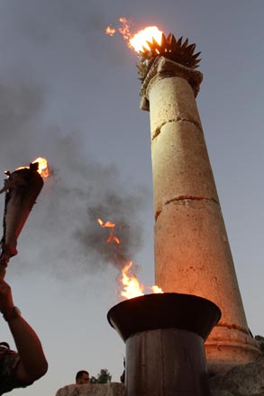 The flame of the Jerash Festival for Culture and Arts is seen at the ancient Greco-Roman city after the event officially opened on Thursday (Photo by Nader Daoud)